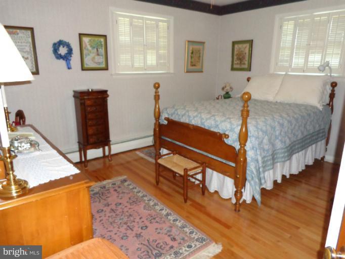 1829 Clear View Road Union Bridge, MD 21791 - Photo 12 of 20 a bedroom with furniture and a wooden floor