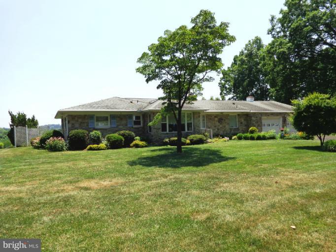 1829 Clear View Road Union Bridge, MD 21791 - Photo 20 of 20 a front view of a house with a garden and trees