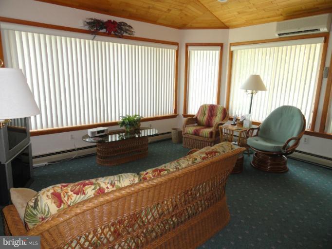 1829 Clear View Road Union Bridge, MD 21791 - Photo 8 of 20 a living room with furniture and floor to ceiling windows