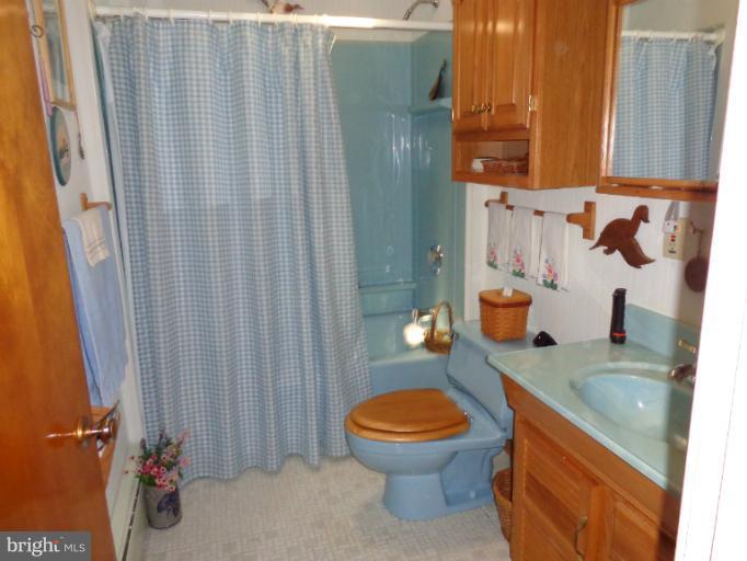 1829 Clear View Road Union Bridge, MD 21791 - Photo 9 of 20 a bathroom with a granite countertop sink and a toilet