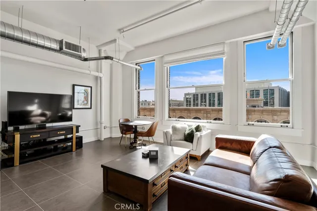 a living room with furniture and a table