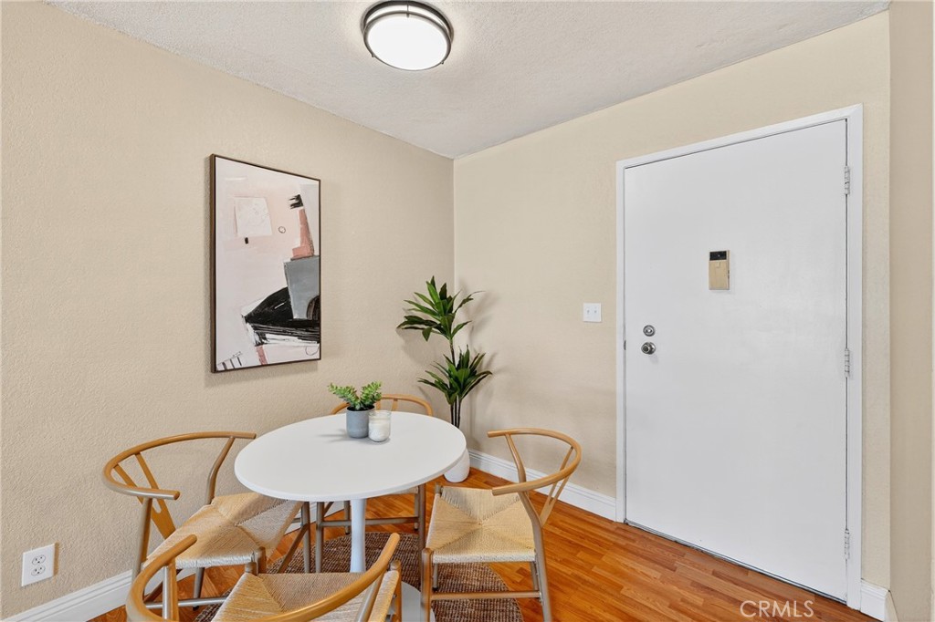 5585 Pacific Coast Highway, Unit 161 Long Beach, CA 90804 - Photo 22 of 44 a view of a livingroom with furniture and wooden floor