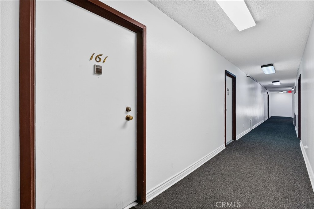 5585 Pacific Coast Highway, Unit 161 Long Beach, CA 90804 - Photo 23 of 44 a view of a hallway with entryway