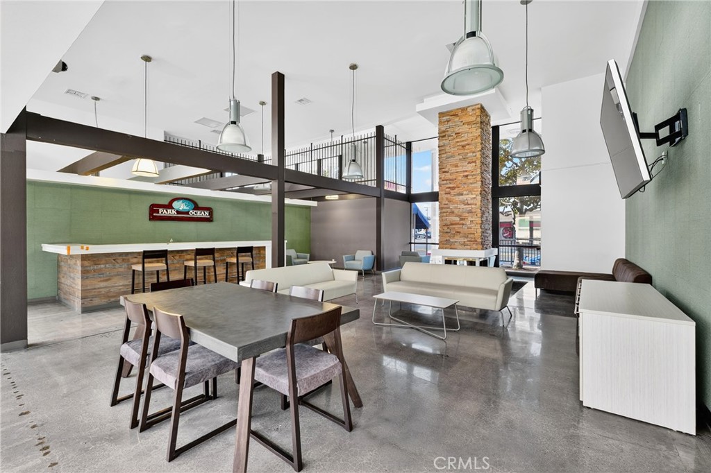 5585 Pacific Coast Highway, Unit 161 Long Beach, CA 90804 - Photo 27 of 44 a view of a dining room with furniture window and wooden floor