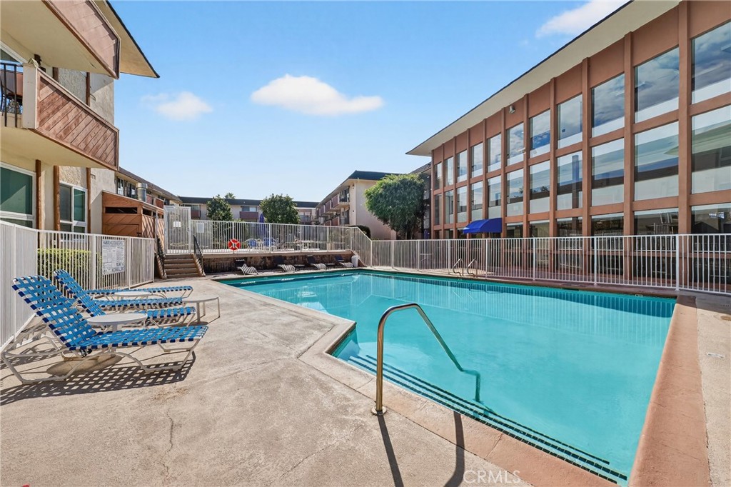 5585 Pacific Coast Highway, Unit 161 Long Beach, CA 90804 - Photo 30 of 44 a view of a house with a swimming pool