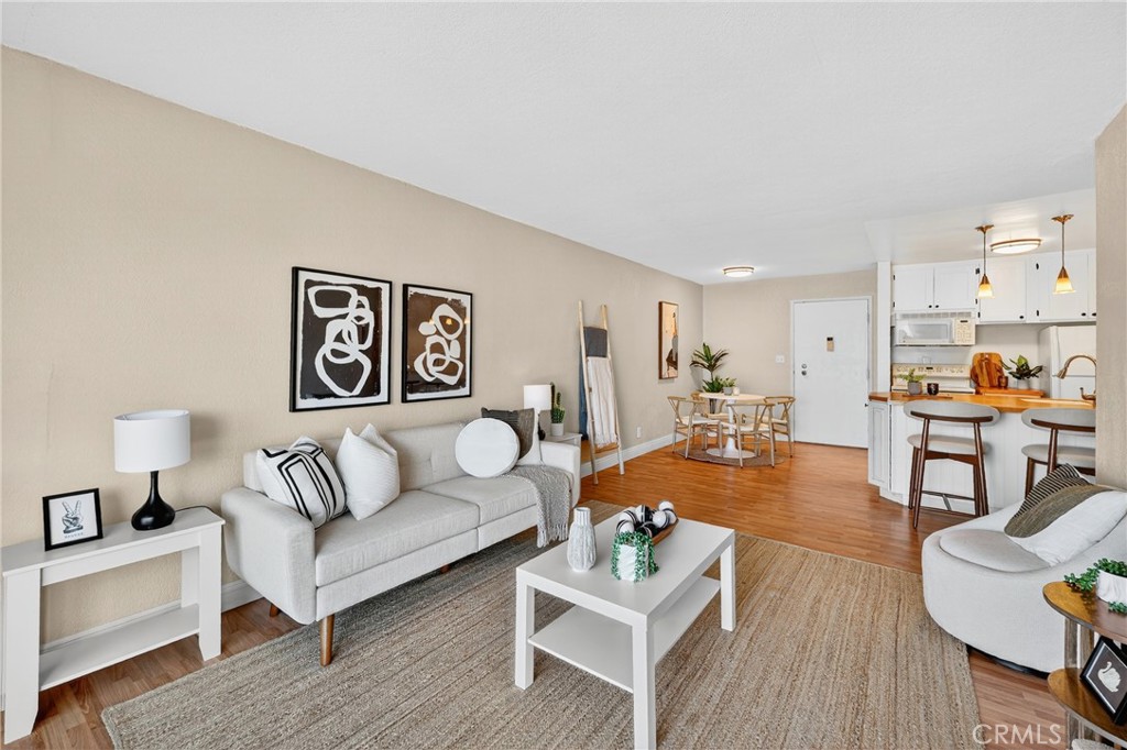 5585 Pacific Coast Highway, Unit 161 Long Beach, CA 90804 - Photo 10 of 44 a living room with furniture and wooden floor