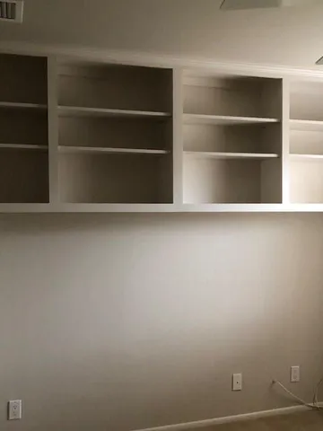 a view of an empty room with empty racks