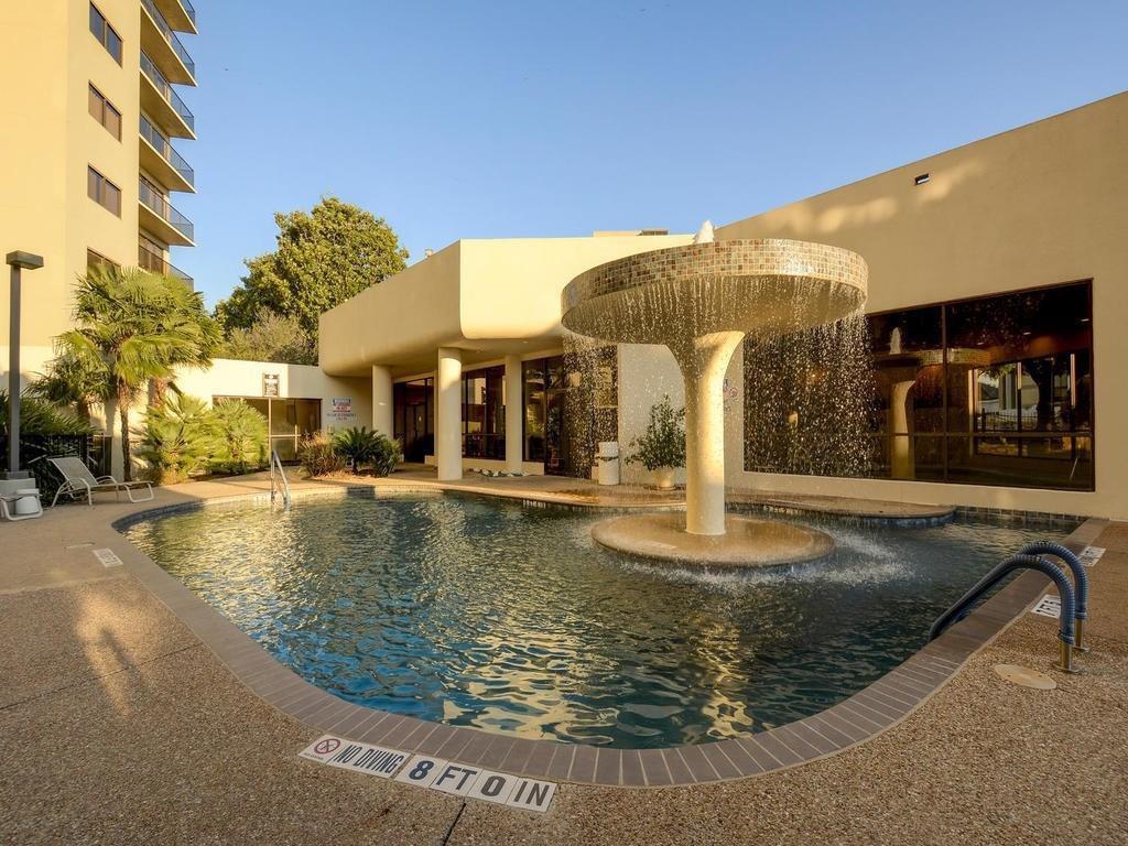 40 North Interstate Highway 35, Unit 2A2 Austin, TX 78701 - Photo 26 of 28 a view of a house with swimming pool