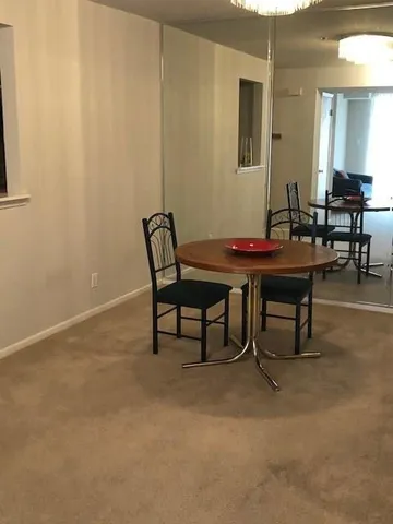 a view of a workspace with furniture