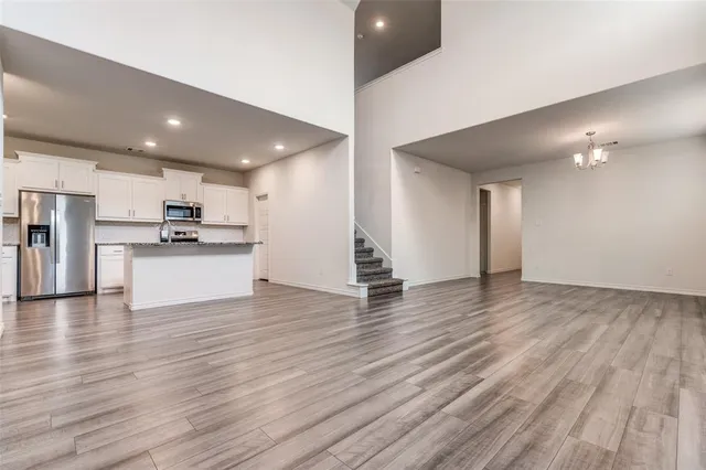 a view of a kitchen with a sink and an oven