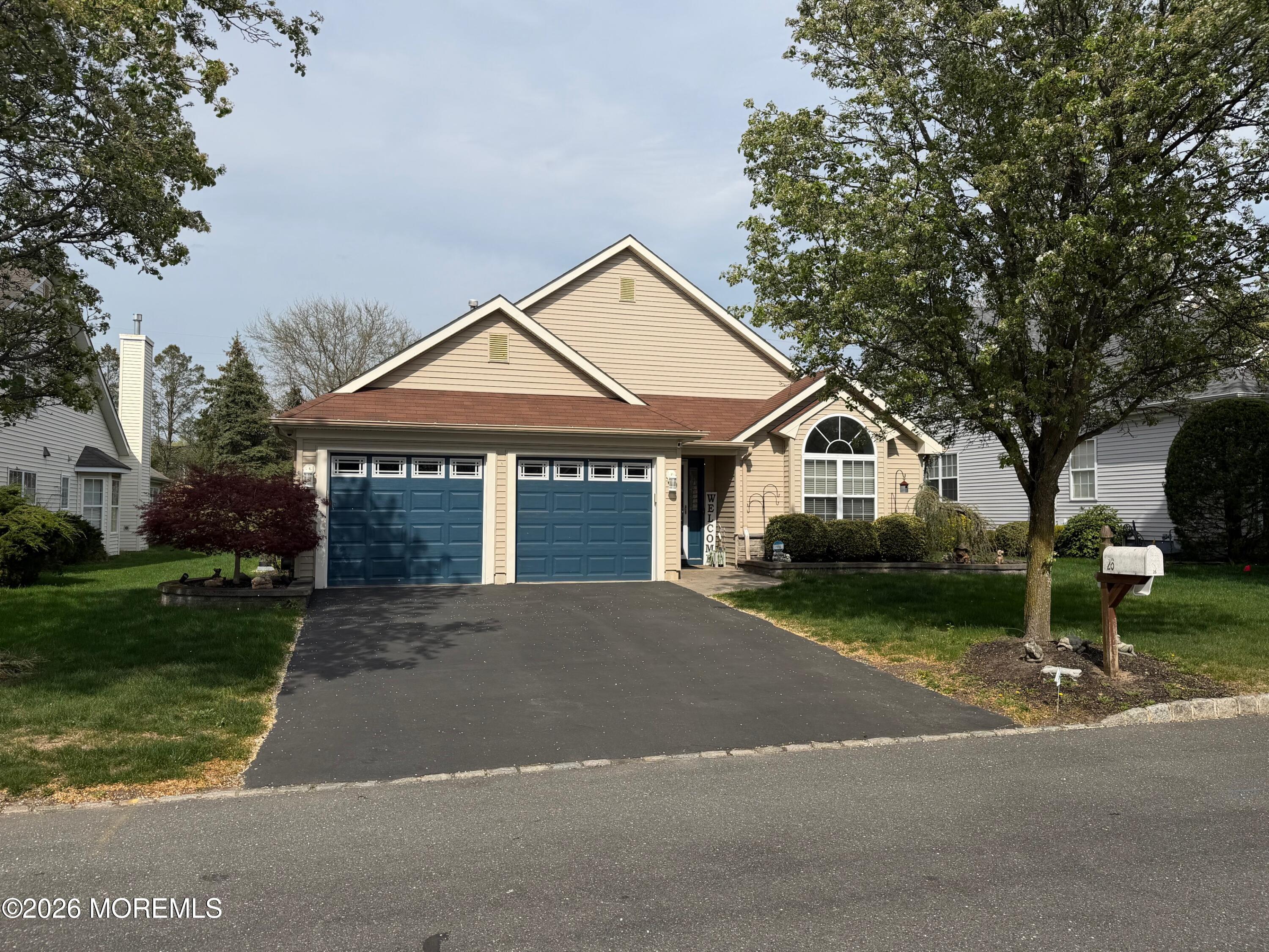 26 Ivy Hill Road Lakewood, NJ 08701 - Photo 1 of 46 a front view of a house with a yard and garage