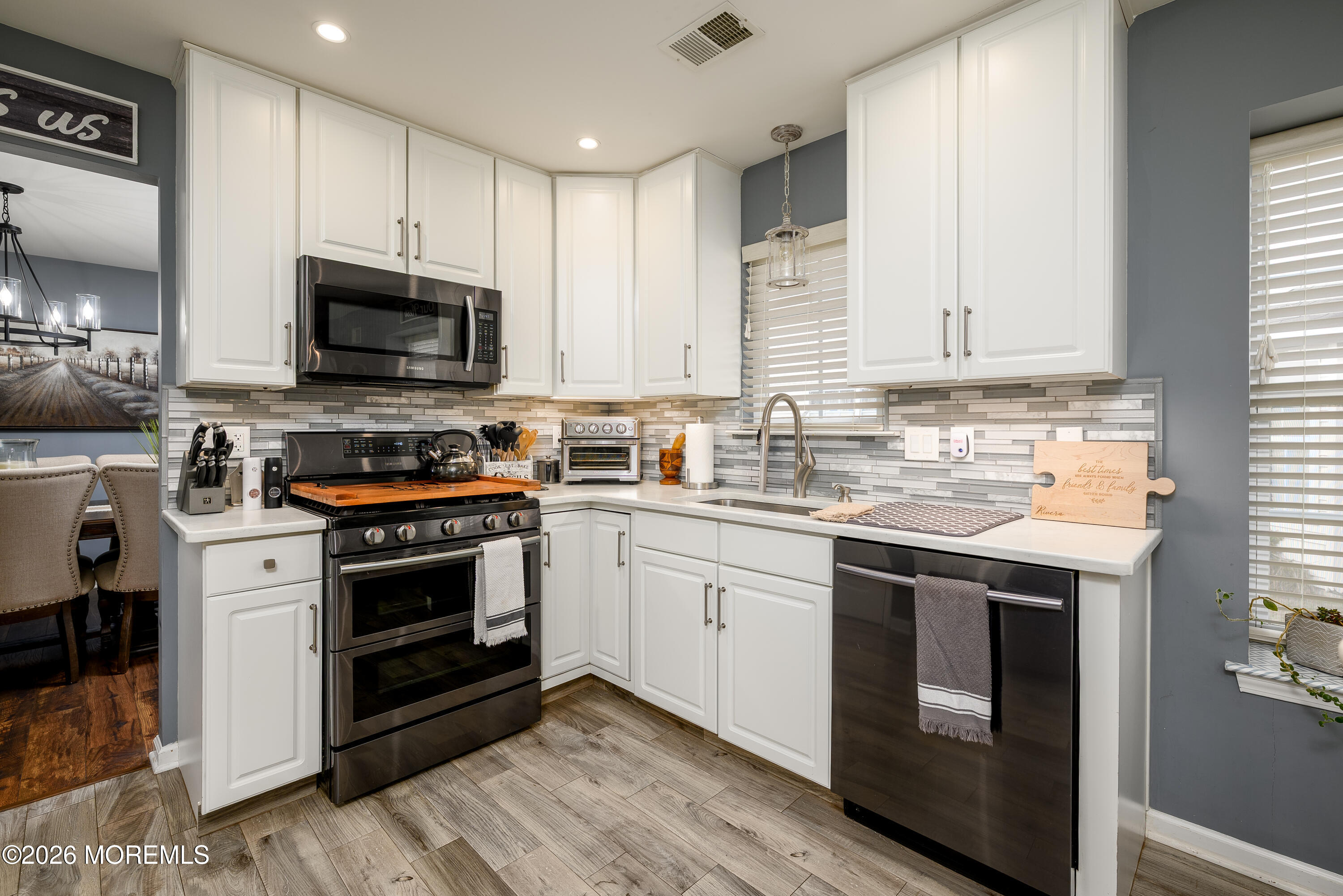 26 Ivy Hill Road Lakewood, NJ 08701 - Photo 13 of 46 a kitchen with stainless steel appliances granite countertop a stove a sink and a microwave