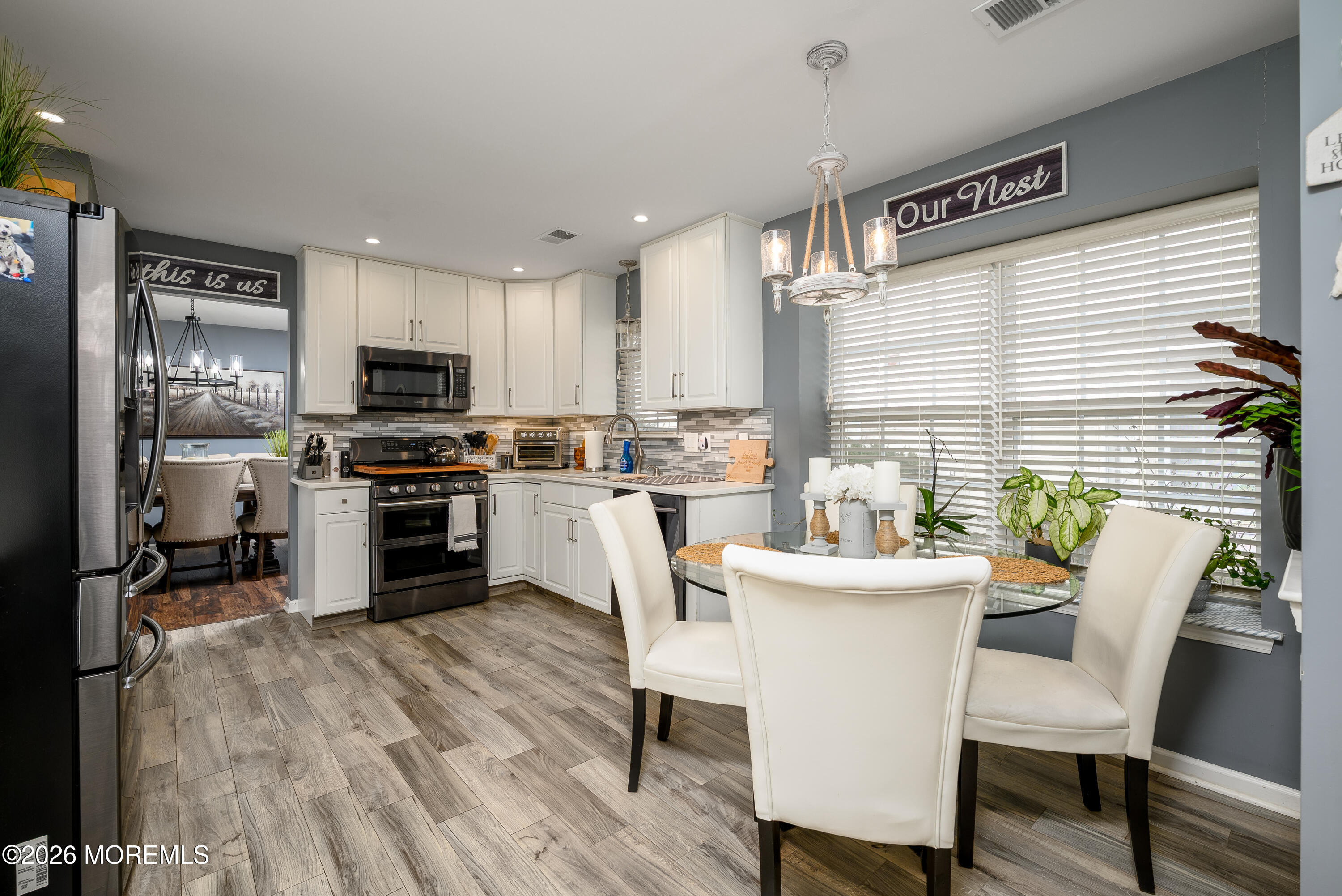 26 Ivy Hill Road Lakewood, NJ 08701 - Photo 14 of 46 a kitchen with sink a microwave cabinets and stainless steel appliances