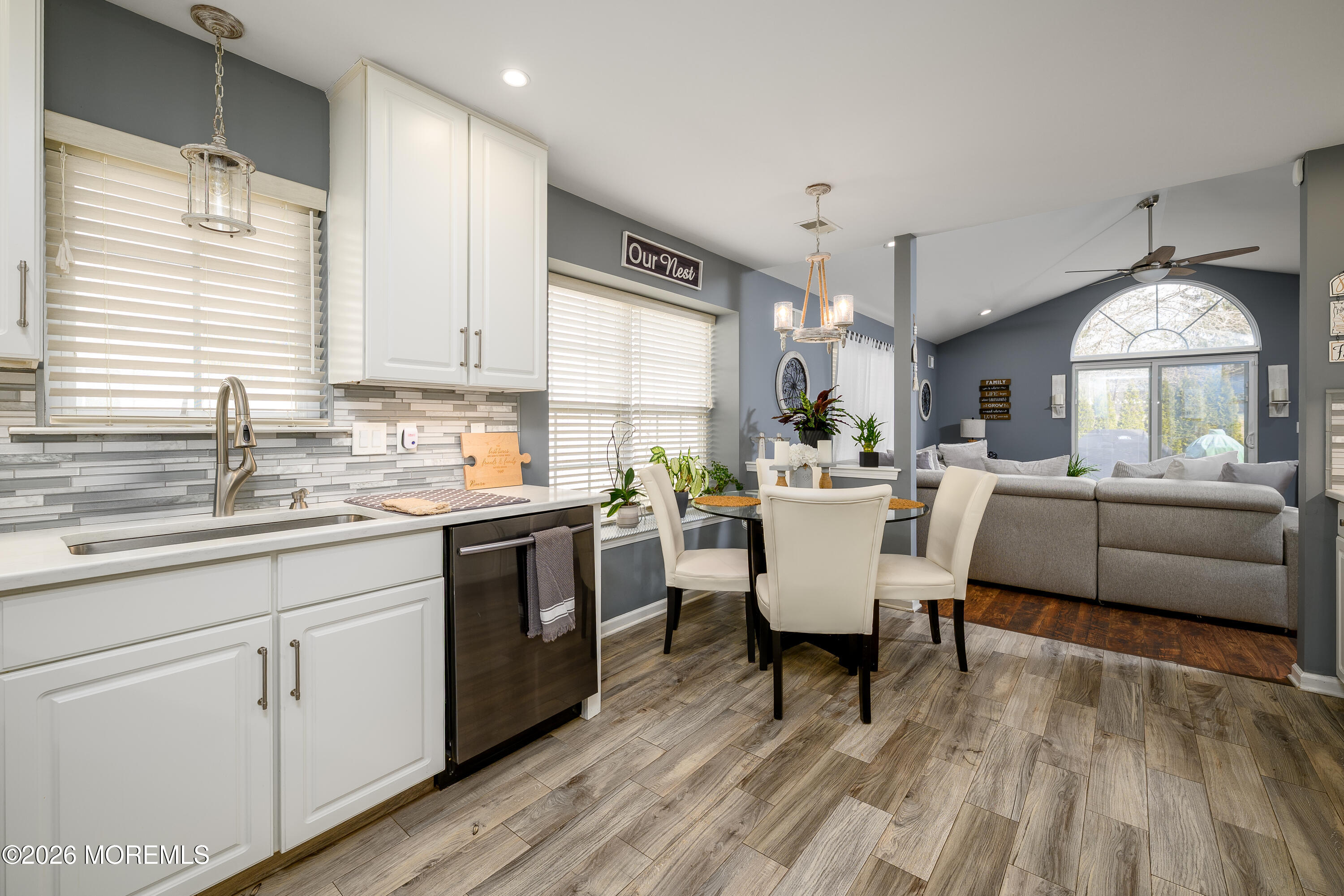 26 Ivy Hill Road Lakewood, NJ 08701 - Photo 15 of 46 a kitchen with a white cabinets and chairs