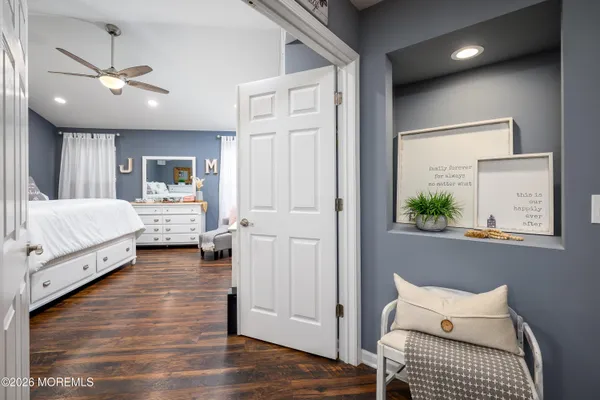 a bedroom with furniture and a chandelier