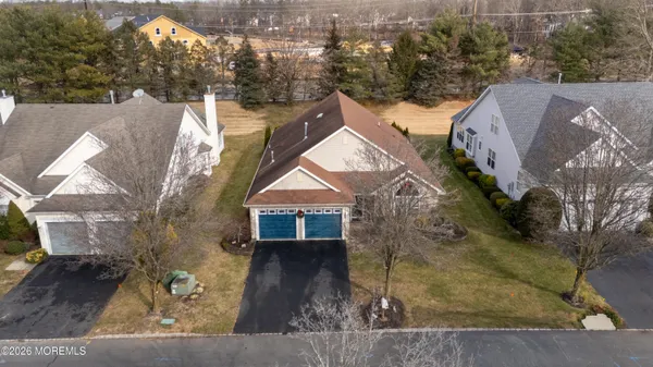 an aerial view of a house with a yard