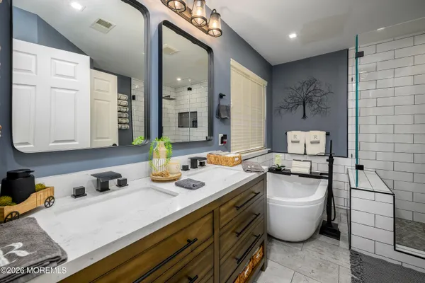 a room with a sink and a stove top oven