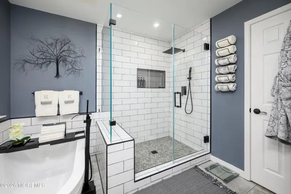 a bathroom with a shower and a sink