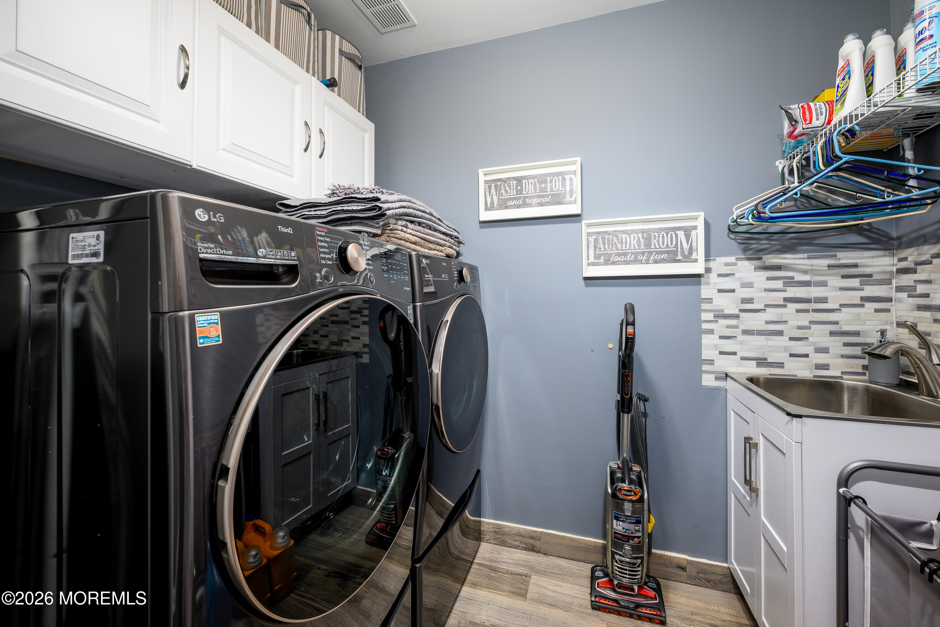 26 Ivy Hill Road Lakewood, NJ 08701 - Photo 31 of 46 a view of a storage and utility room with washer and dryer