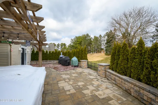 a view of a patio with a table and chairs