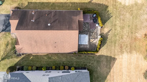 an aerial view of house with a yard