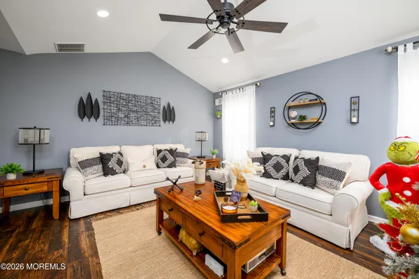 a living room with furniture and a rug