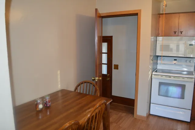a kitchen with a stove and a refrigerator
