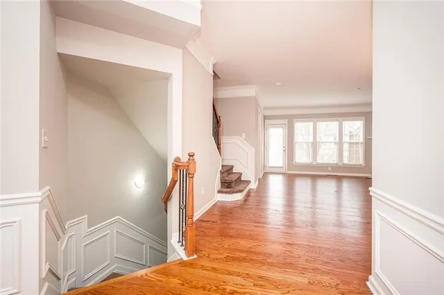 a view of an entryway with wooden floor