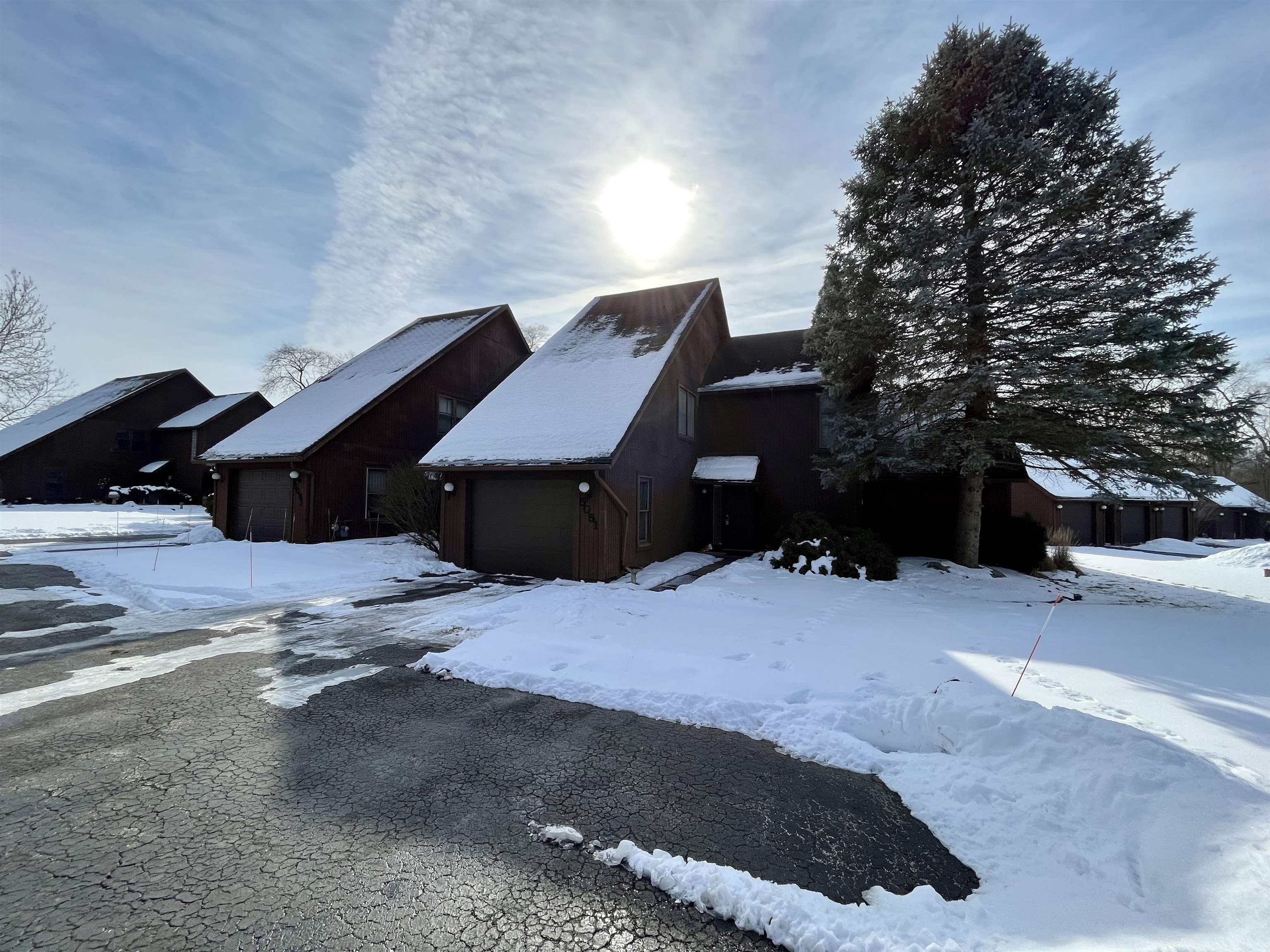 5051 Woodlake Drive Loves Park, IL 61111 - Photo 1 of 20 a backyard of a house with table and chairs