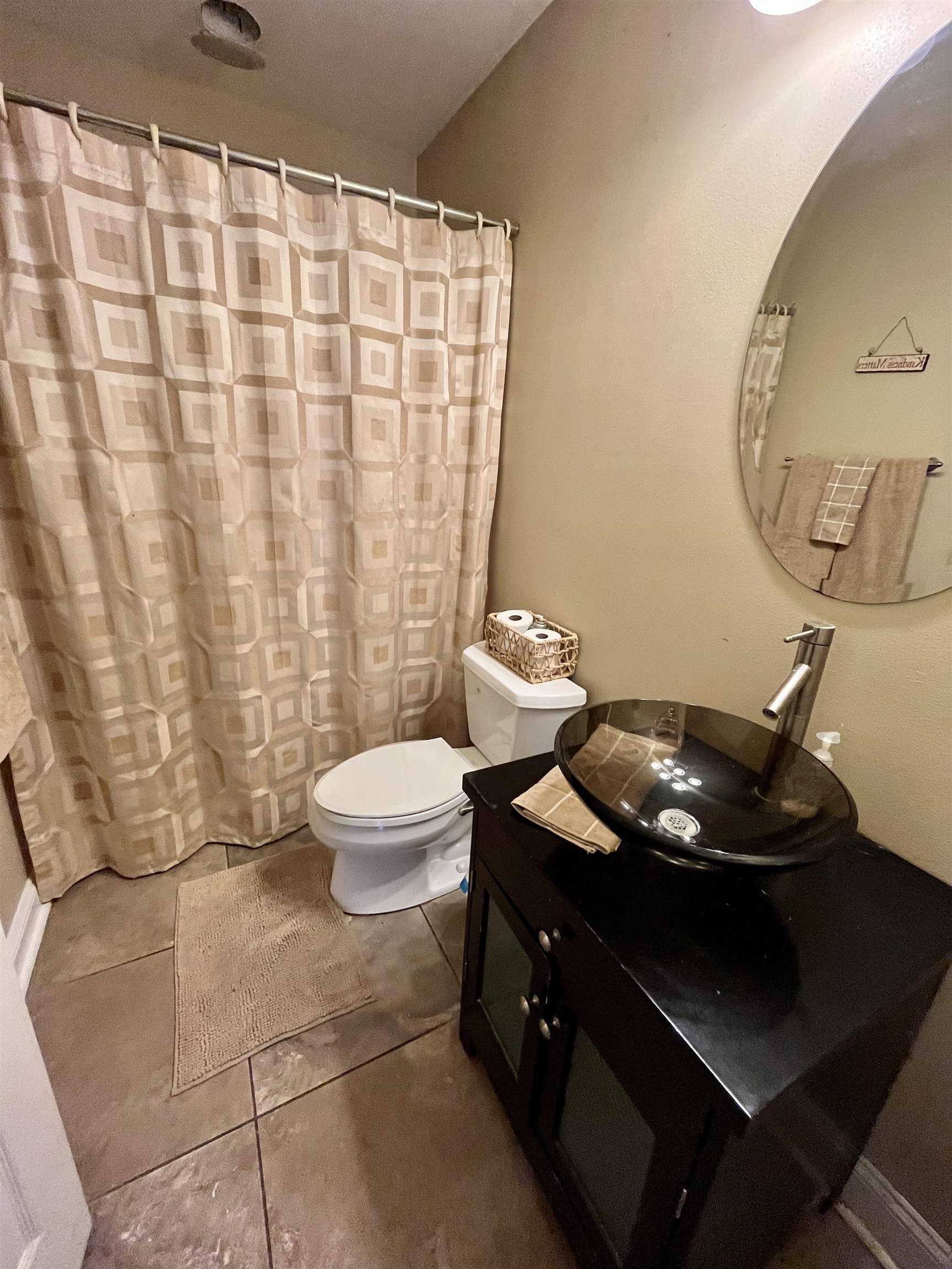 5051 Woodlake Drive Loves Park, IL 61111 - Photo 12 of 20 a bathroom with a sink toilet and shower