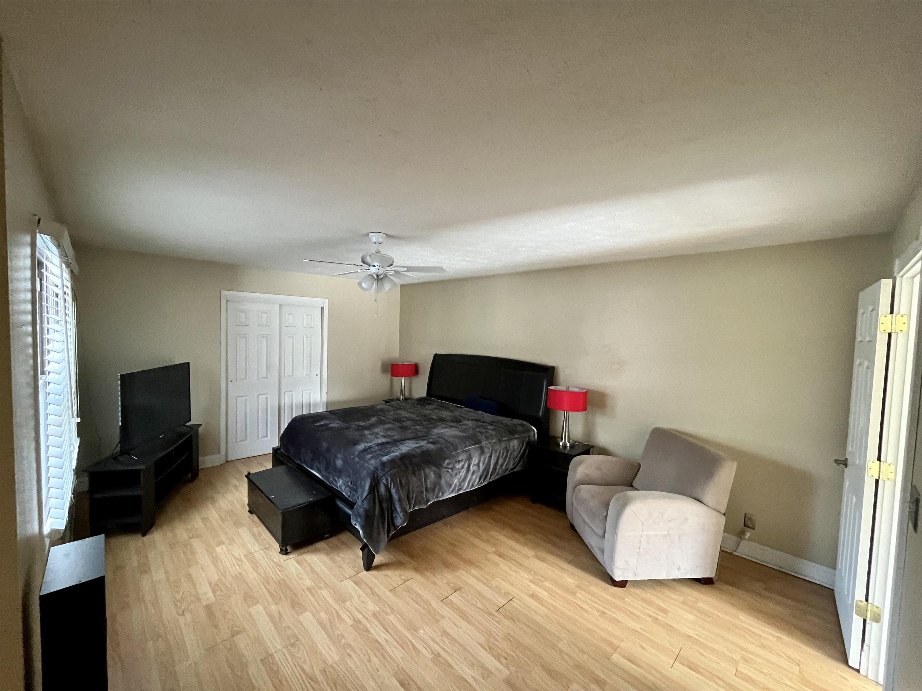 5051 Woodlake Drive Loves Park, IL 61111 - Photo 14 of 20 a living room with furniture and a flat screen tv