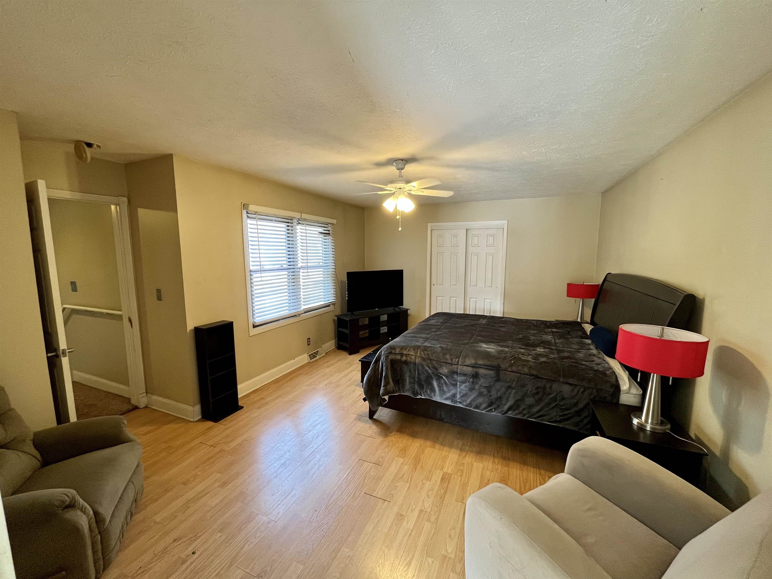 5051 Woodlake Drive Loves Park, IL 61111 - Photo 15 of 20 a bedroom with a bed dresser and a window
