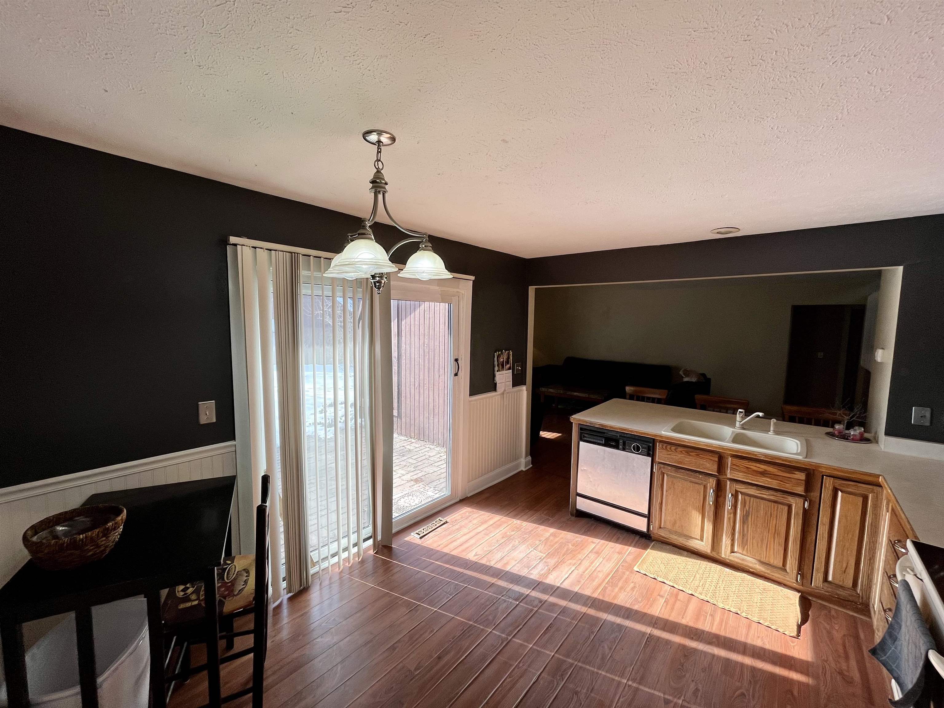 5051 Woodlake Drive Loves Park, IL 61111 - Photo 3 of 20 a living room with furniture and a flat screen tv