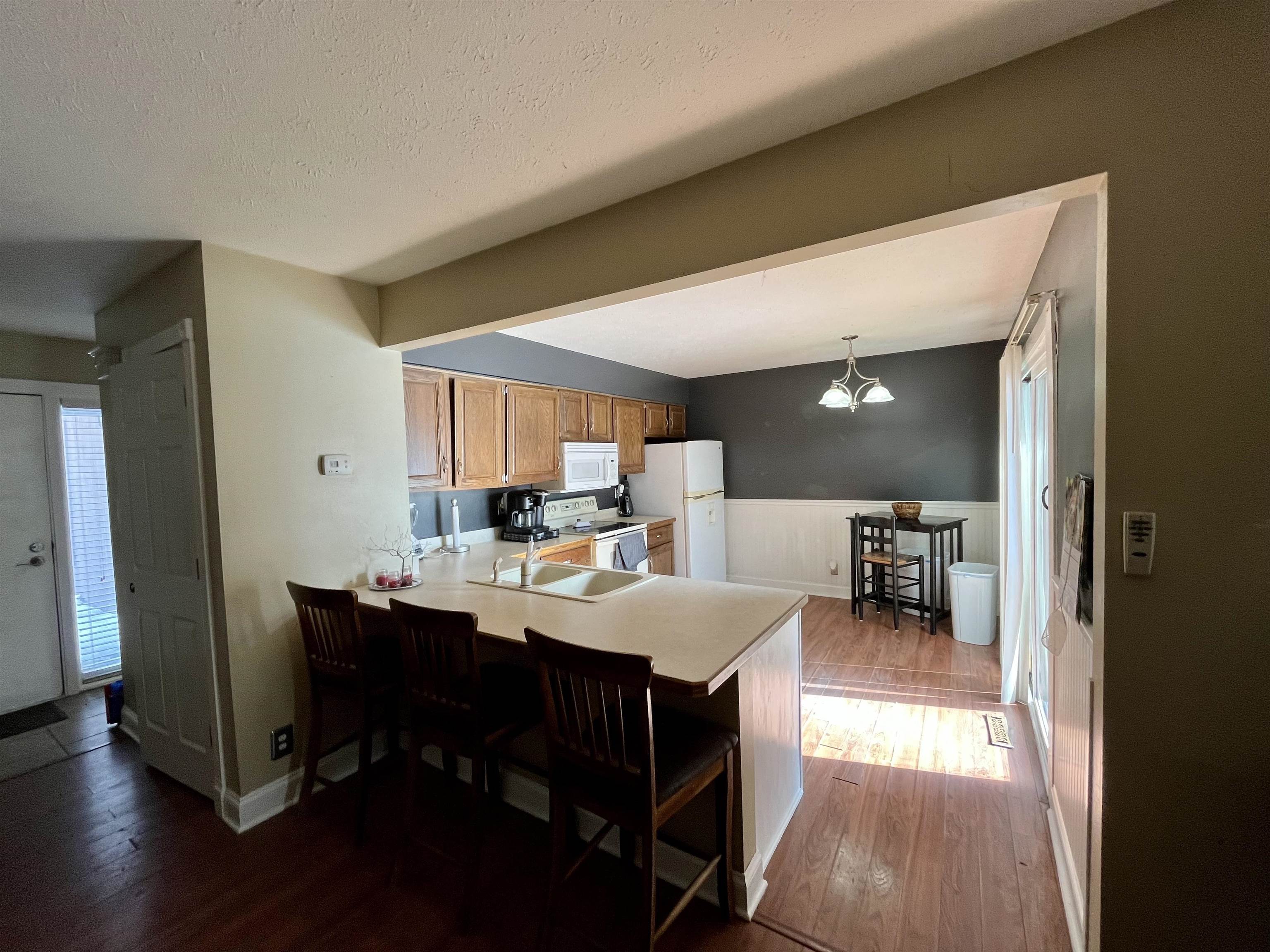 5051 Woodlake Drive Loves Park, IL 61111 - Photo 4 of 20 a view of a dining room with furniture and wooden floor