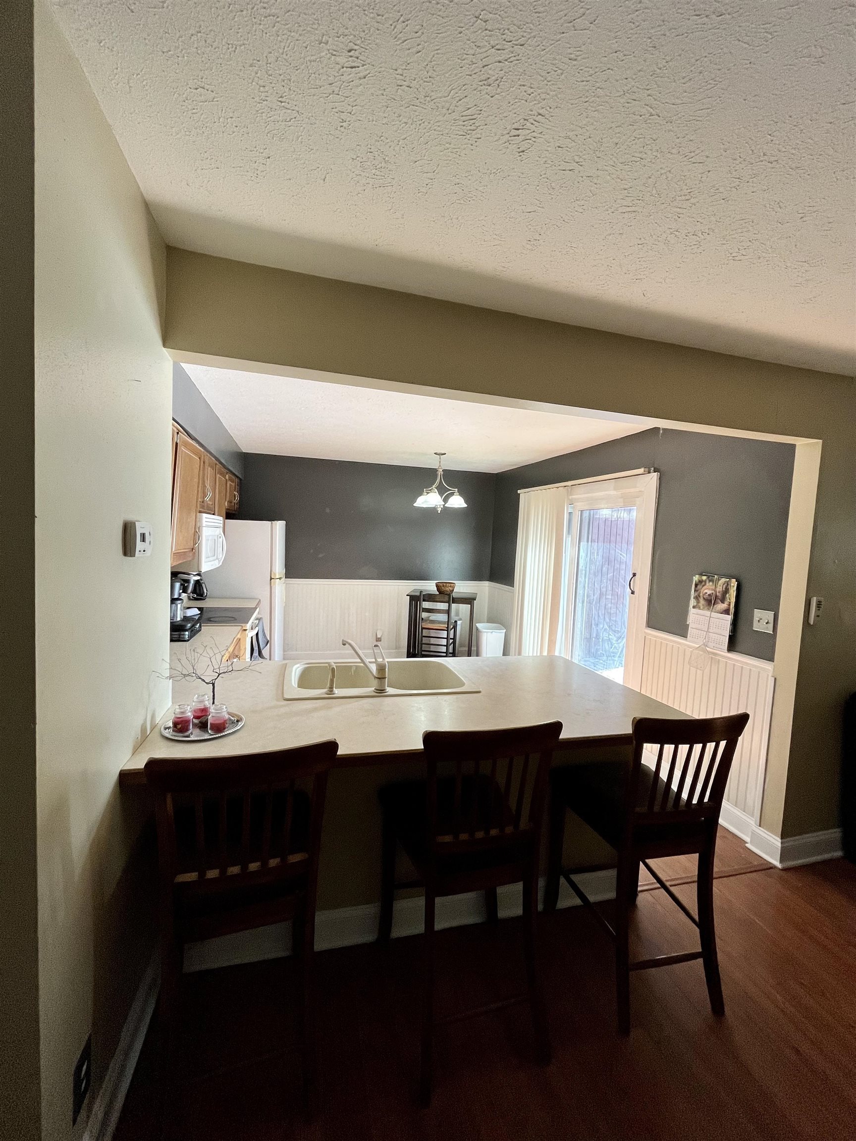 5051 Woodlake Drive Loves Park, IL 61111 - Photo 5 of 20 a dining room with a wooden table and chairs