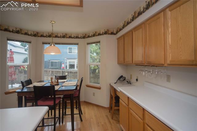 6695 Turkey Tracks Road Colorado Springs, CO 80922 - Photo 8 of 34 Dining nook attached to kitchen