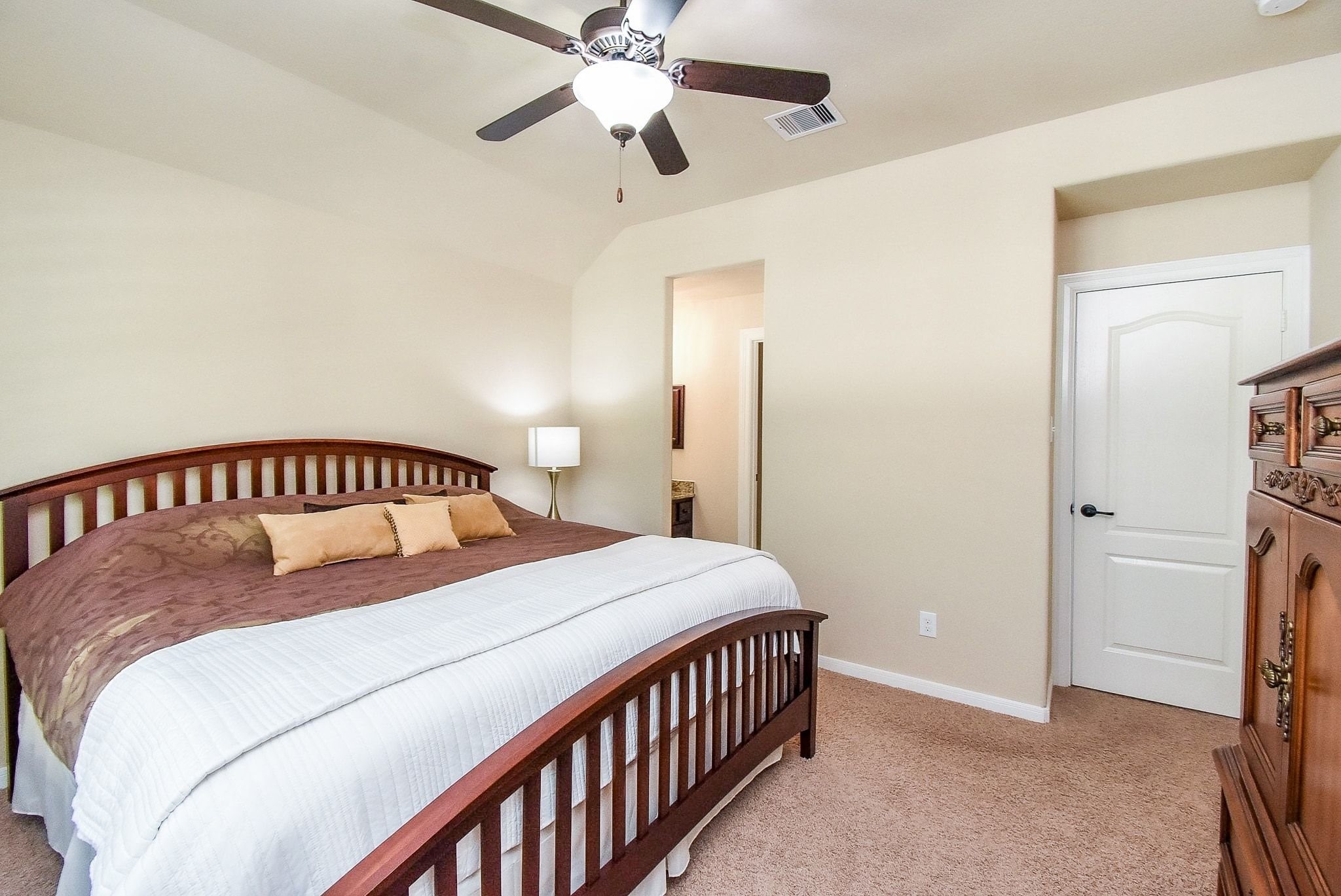 27607 Macklind Ridge Lane Katy, TX 77494 - Photo 42 of 50 Secondary bedroom with king size bed and furniture, ceiling fan and part of the Hollywood bath. Separate sink and walk in closet.
