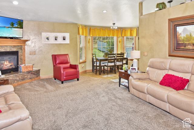 1500 Fish Creek Road Bancroft, ID 83217 - Photo 12 of 45 Carpeted living room with a premium fireplace and recessed lighting