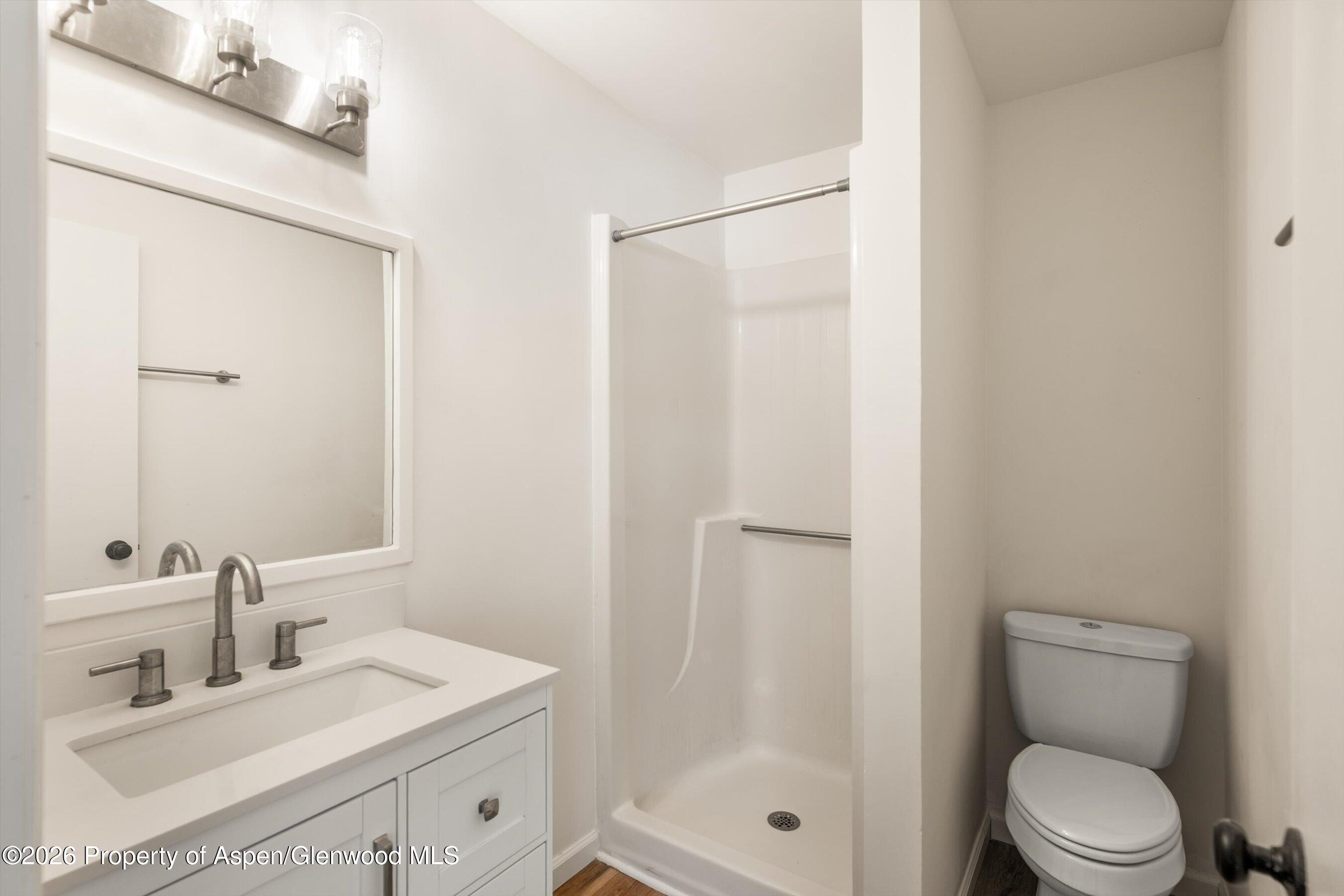 942 West 5th Street Rifle, CO 81650 - Photo 14 of 23 a bathroom with a sink a toilet and shower