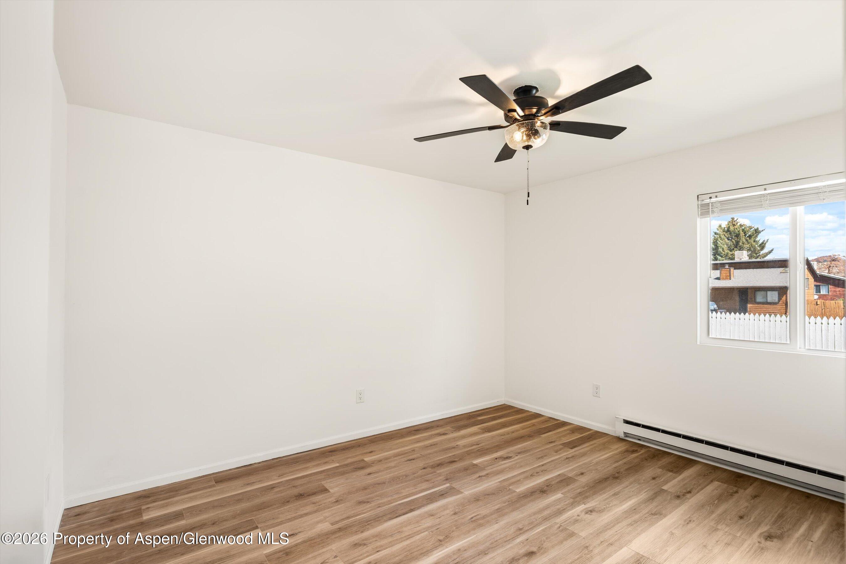 942 West 5th Street Rifle, CO 81650 - Photo 15 of 23 a view of a room with a ceiling fan and wooden floor