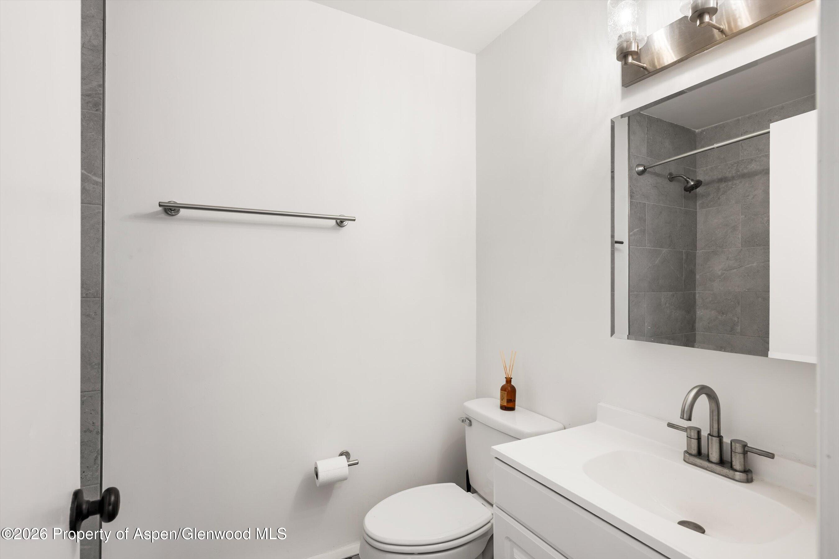 942 West 5th Street Rifle, CO 81650 - Photo 17 of 23 a bathroom with a sink toilet and shower