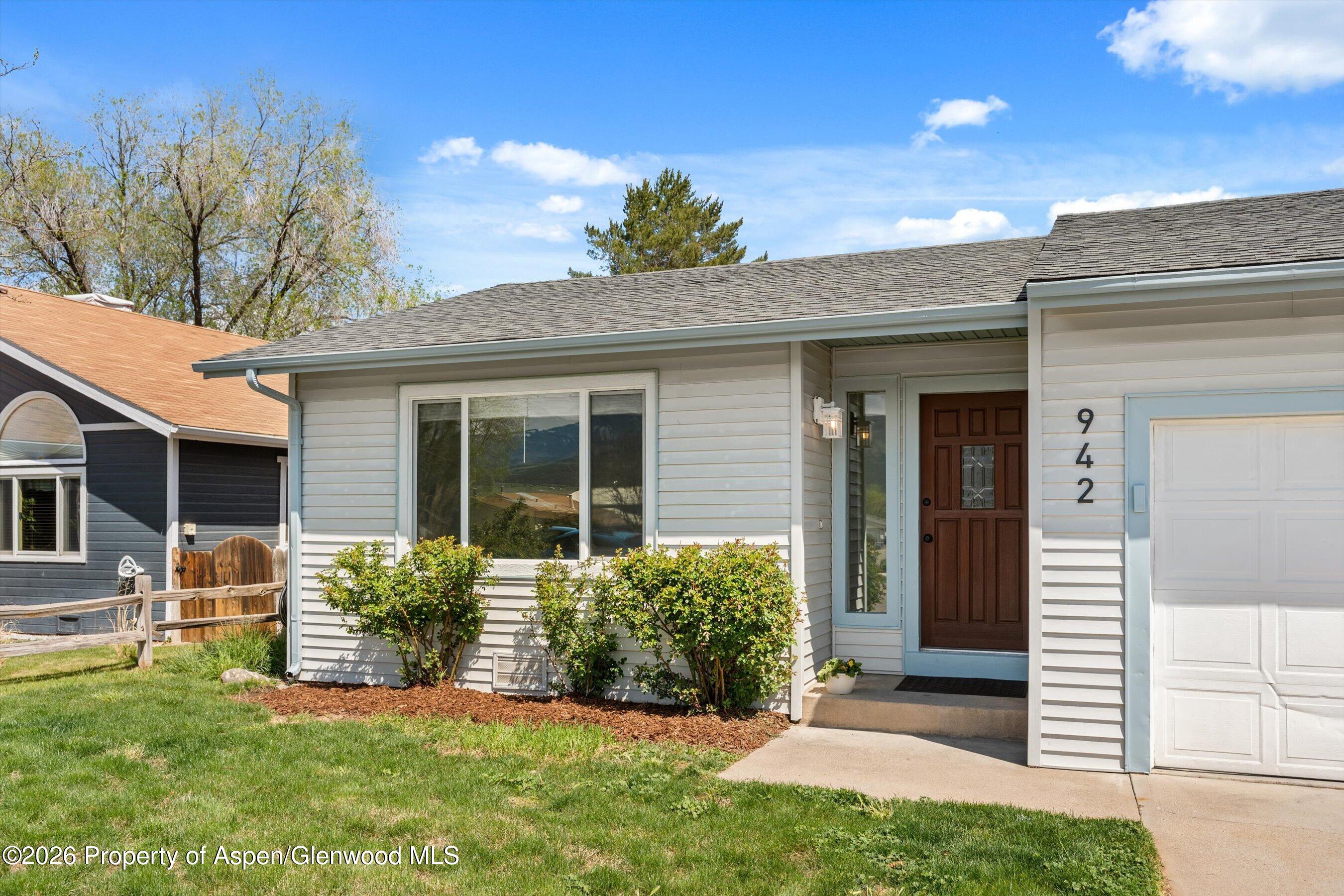 942 West 5th Street Rifle, CO 81650 - Photo 19 of 23 a front view of a house with a yard