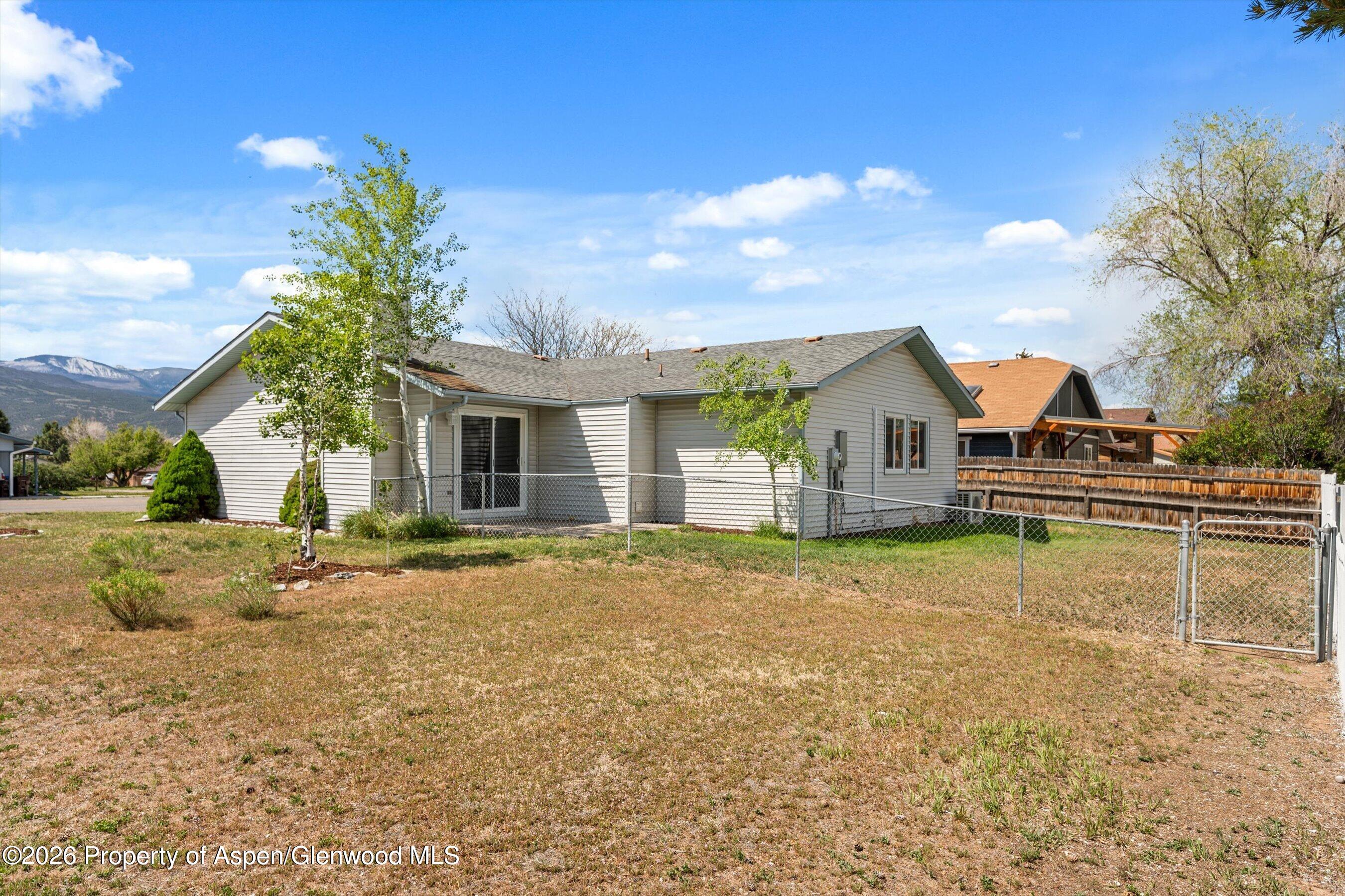 942 West 5th Street Rifle, CO 81650 - Photo 23 of 23 a front view of a house with a yard