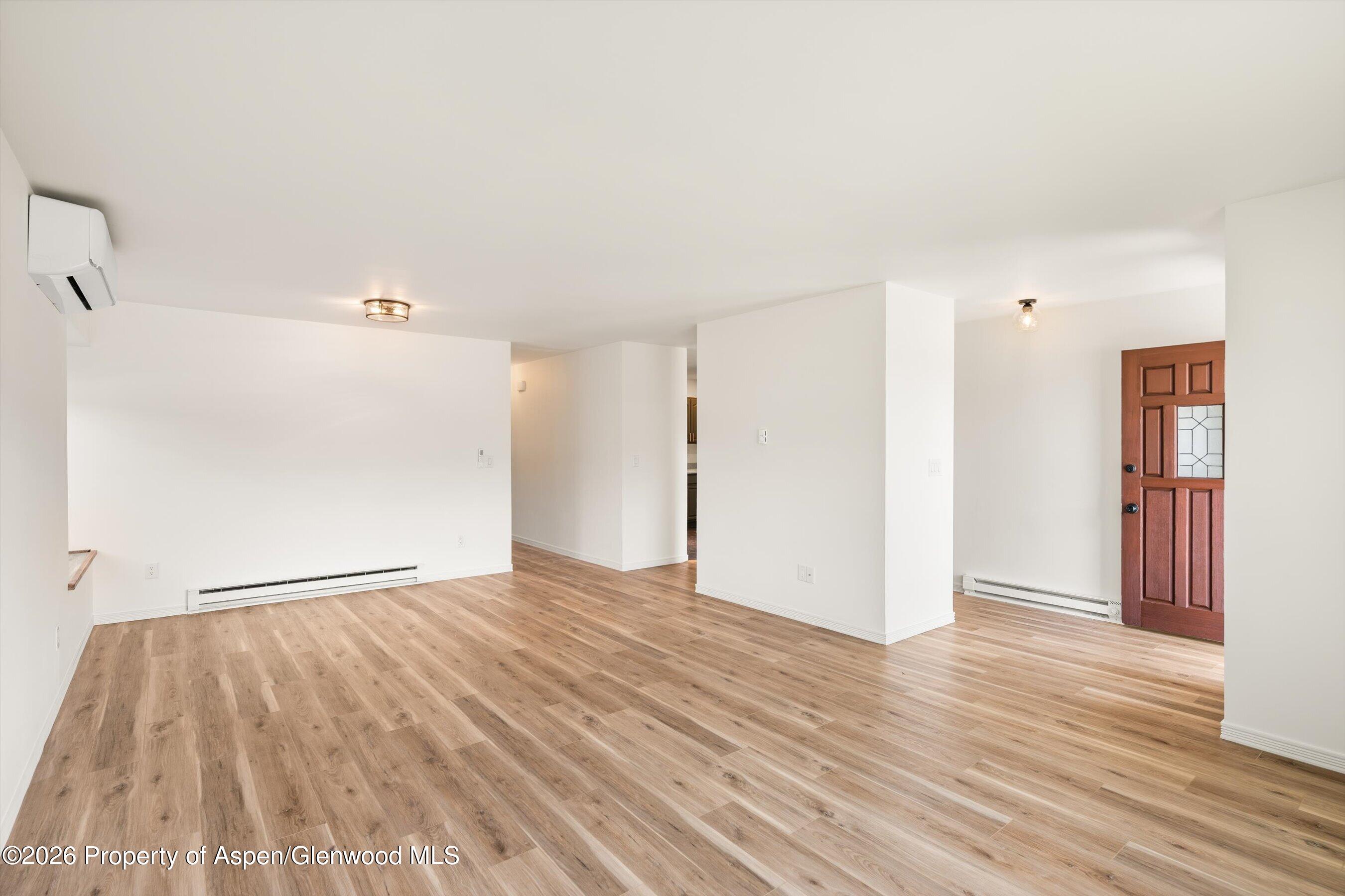 942 West 5th Street Rifle, CO 81650 - Photo 6 of 23 a view of an empty room and wooden floor