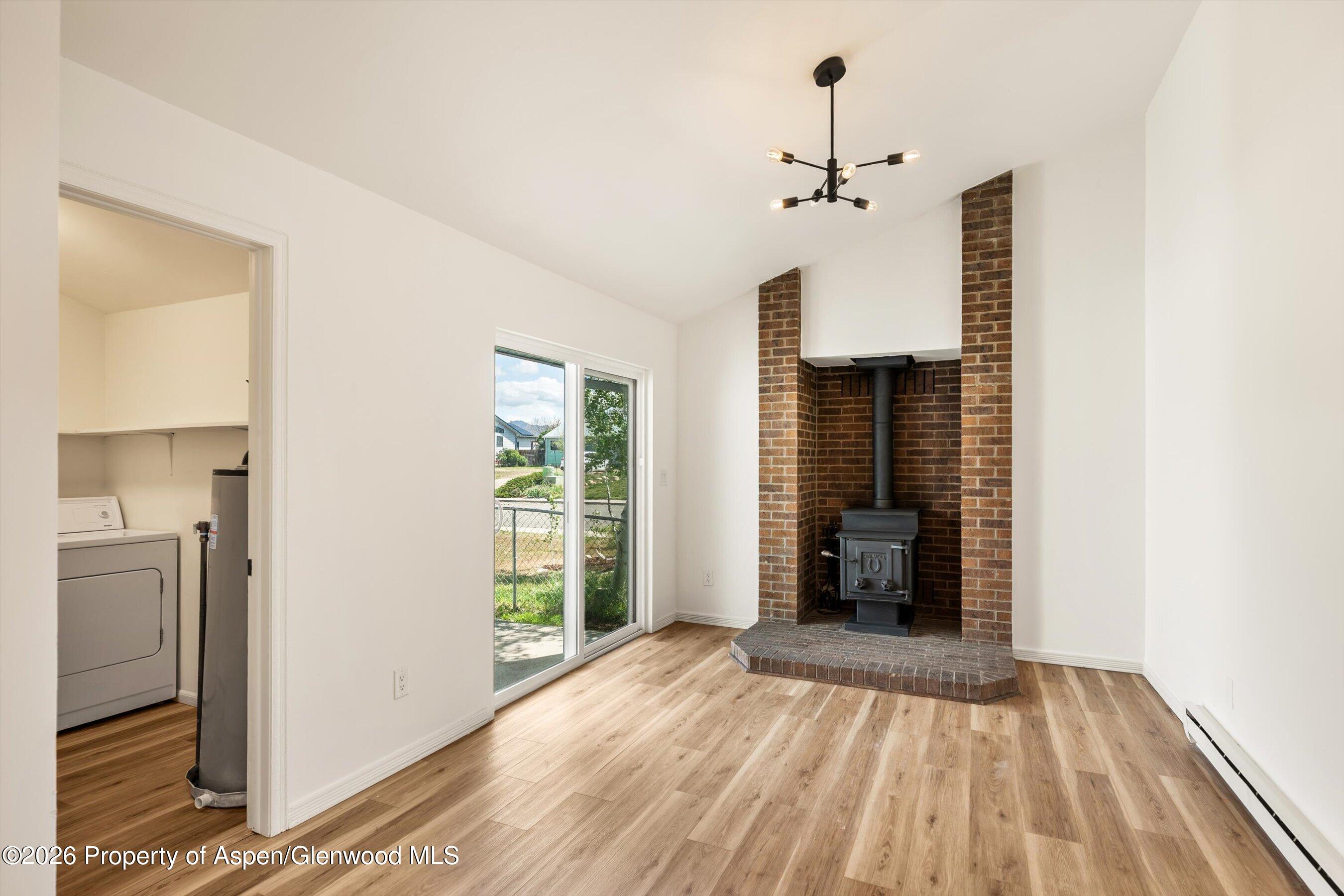 942 West 5th Street Rifle, CO 81650 - Photo 9 of 23 a view of a room with an entryway and wooden floor