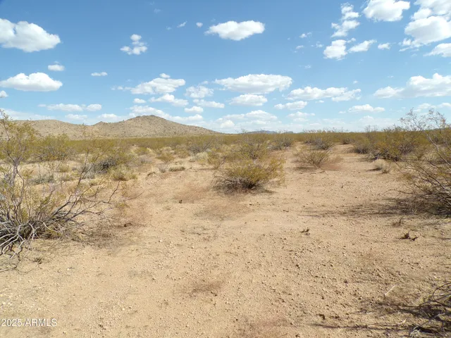 a view of an lake with mountains in the background