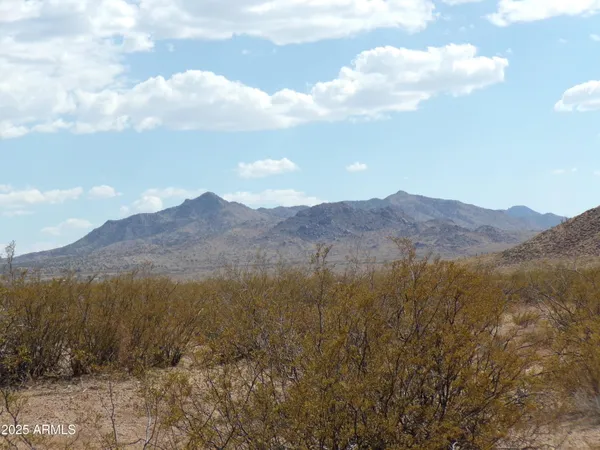 a view of mountain and mountains
