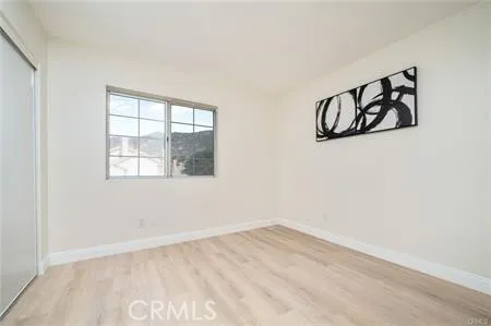 a bathroom with a sink mirror and a bathtub with shower