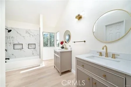 a bathroom with a bathtub and a shower