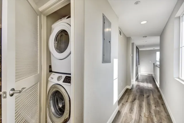 a view of a hallway with washer and dryer